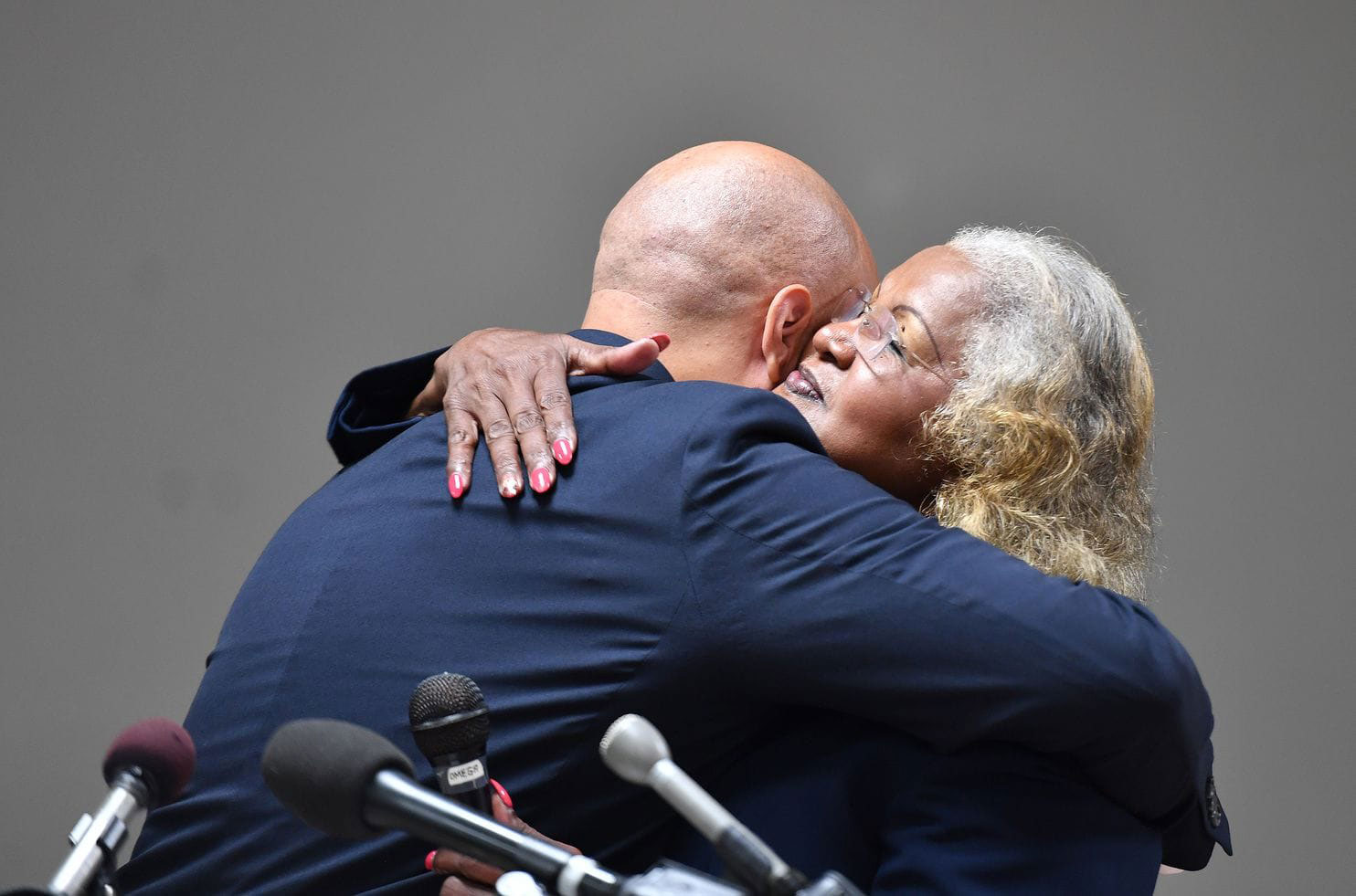 Maryland State Senator Joanne Curtis hugs Curtis Brooks at the press conference 